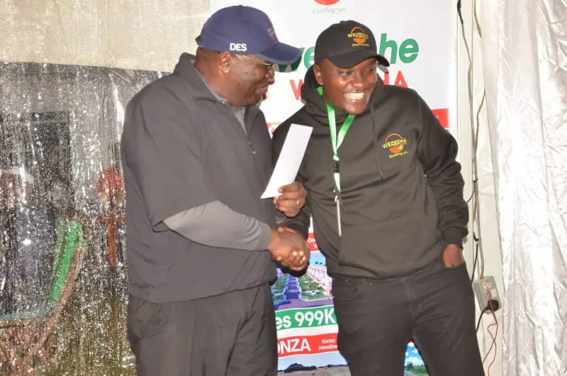 Title deed handover ceremony